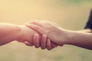 empathy in relationships - two people empathetically holding hands