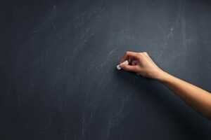 Hand writing on blackboard representing What Your Therapist Wishes You Knew