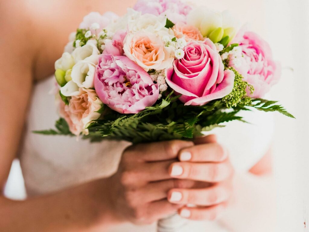 Bouquet of pink and green flowers. Three essential ingredients how to have a great marriage.