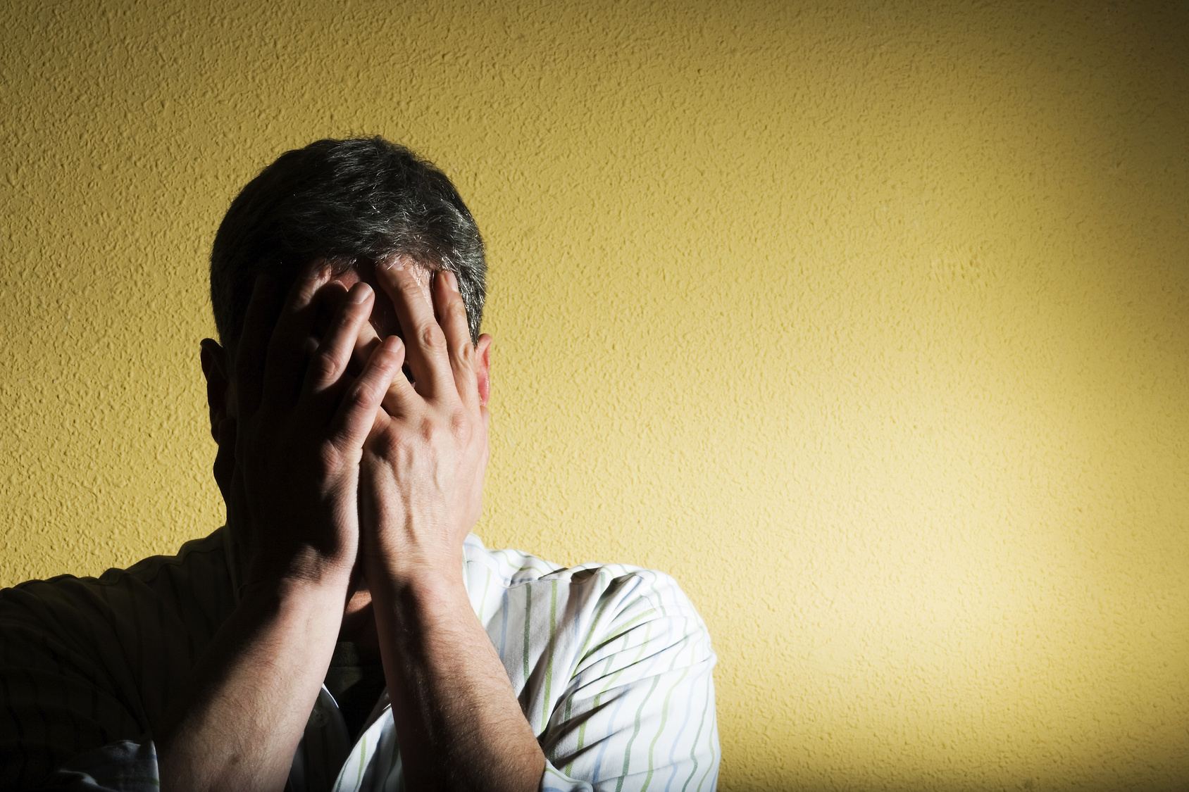 man looking guilty, representing how to say goodbye to unhealthy guilt