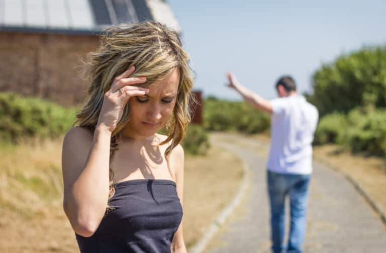 Man walking away from woman representing 5 Biggest Relationship Mistakes