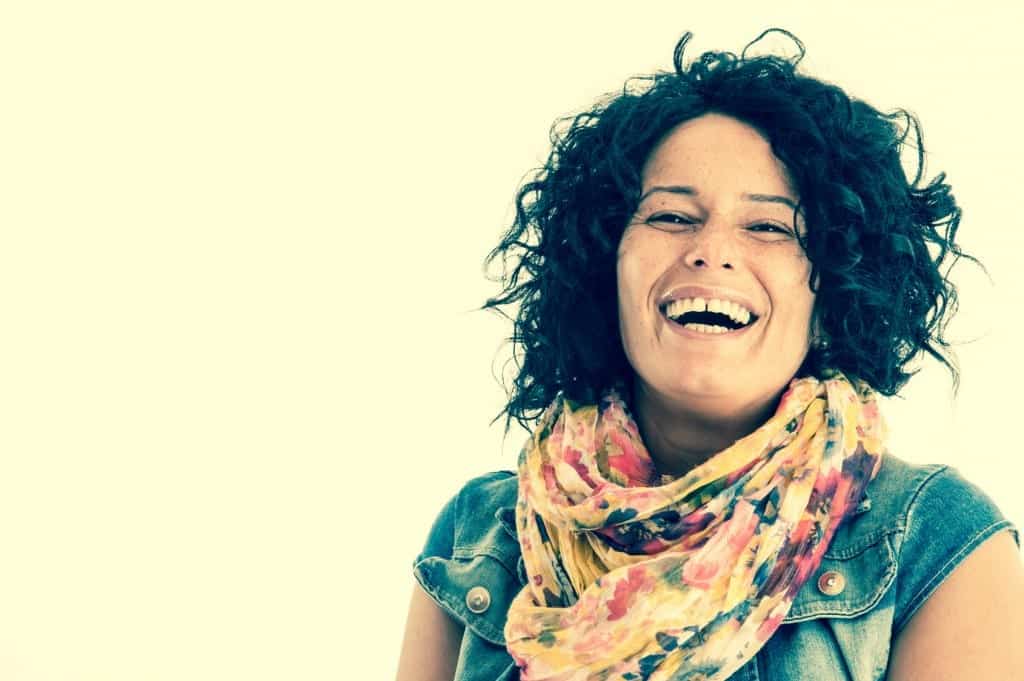 Woman looking happy - here's how to be happier