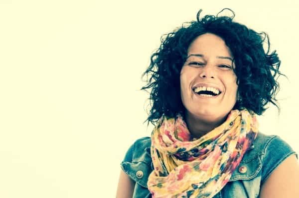 Woman looking happy - here's how to be happier