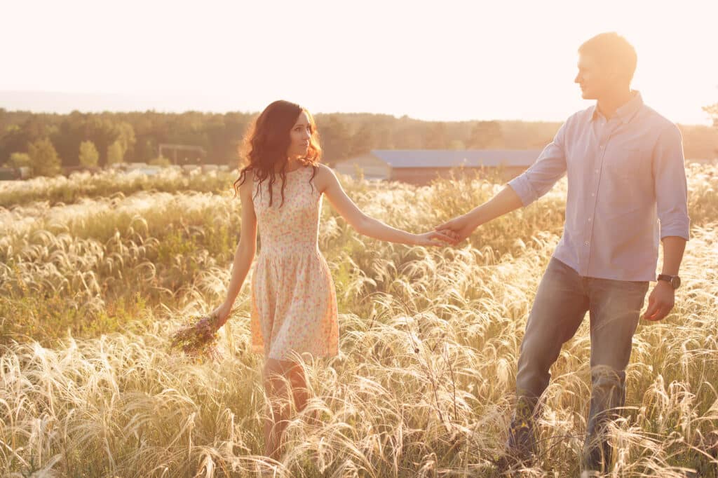 Couple walking and holding hands outside get Your Relationship Questions Answered