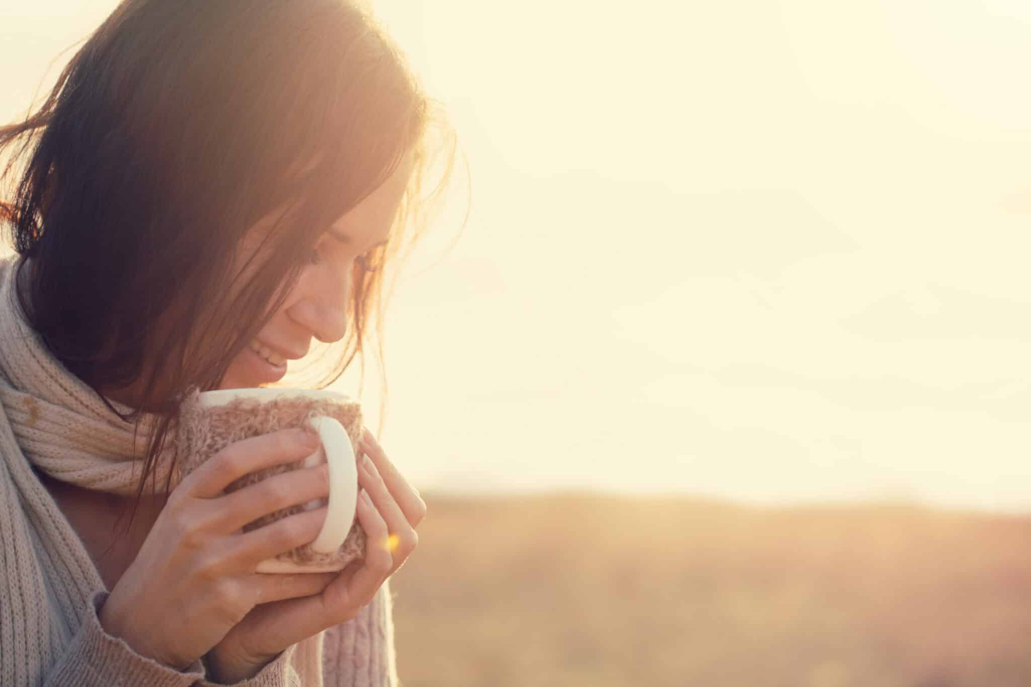 woman outside with a mug. savoring: the easiest mindfulness meditation technique ever.