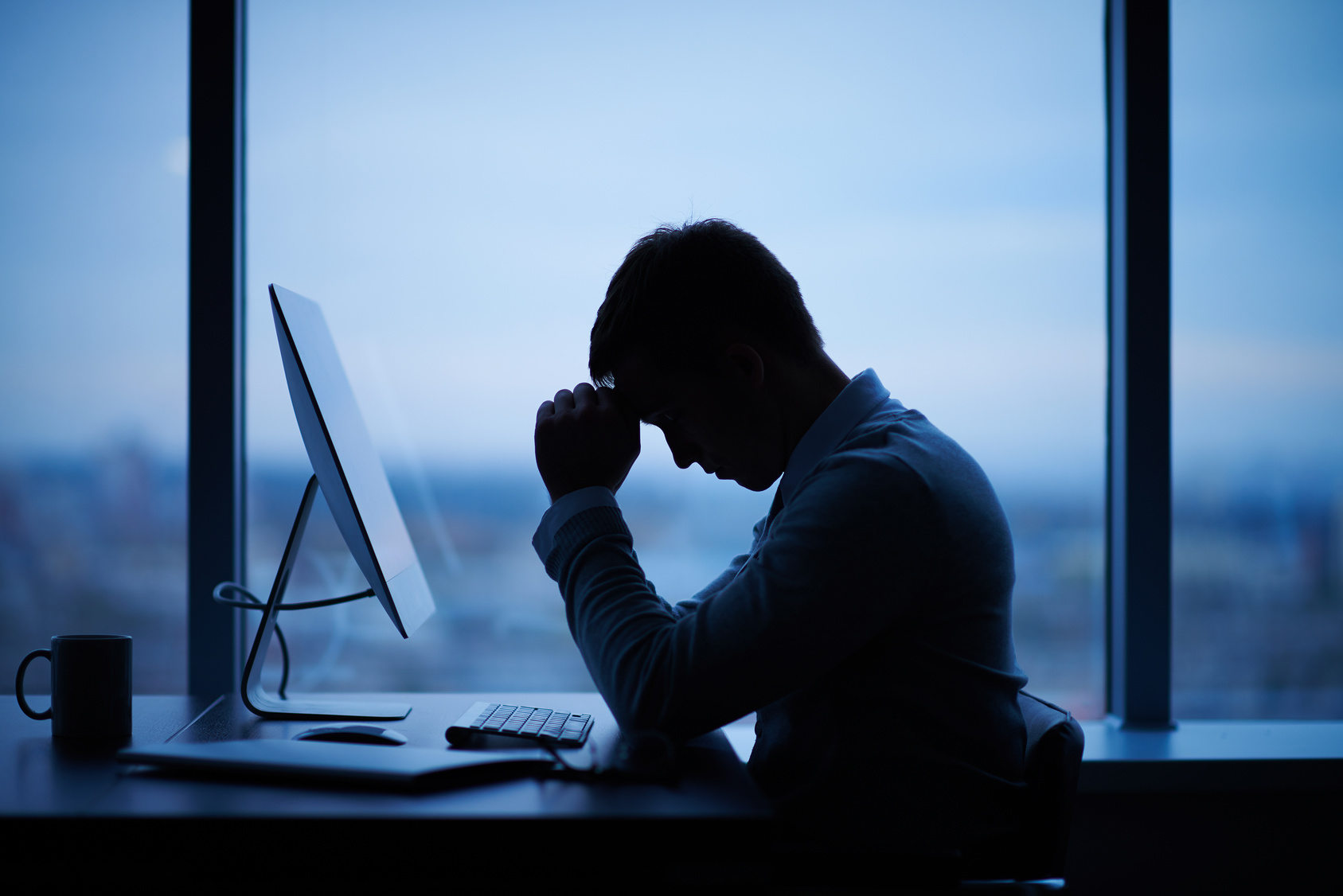 Man looking depressed at work representing What To Do If You Hate Your Job
