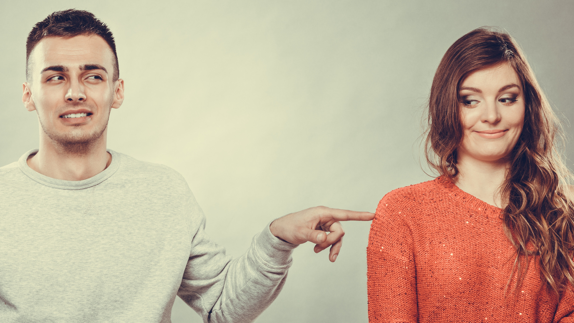 Man poking woman playfully with the best online dating advice