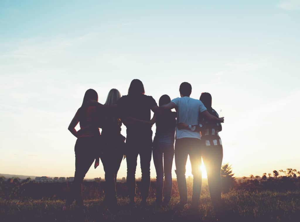 Group of friends outside. feeling lonely? how to find true friendship in a frantic world.