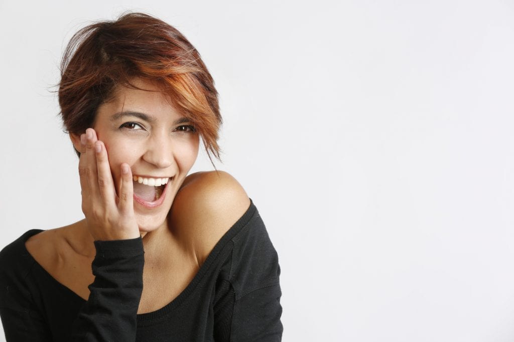 A happy woman representing Singles in America: The Research is In!