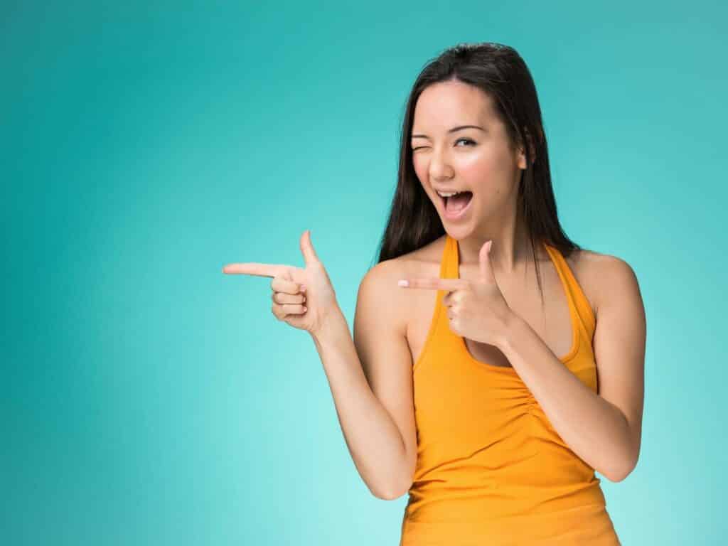 Confident woman showing How to Stop Worrying, and Start Living Fearlessly.