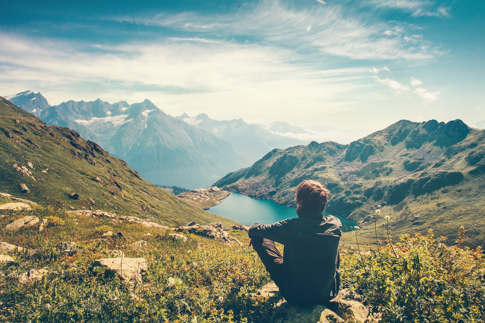 Man hiking, looking out over a gorgeous view ready to makeover his life