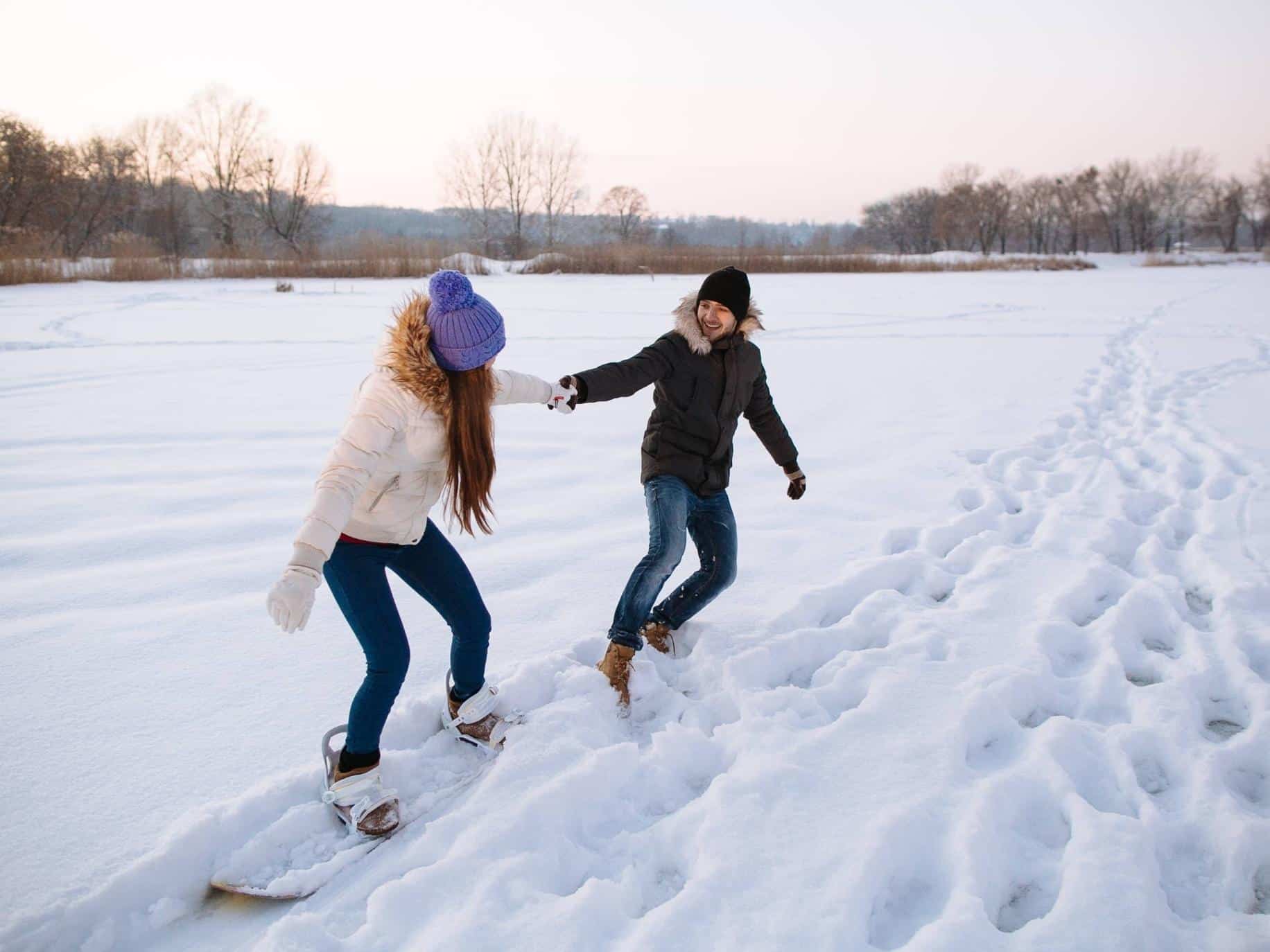 Couple holding hands in the snow working on getting their relationship back on track.