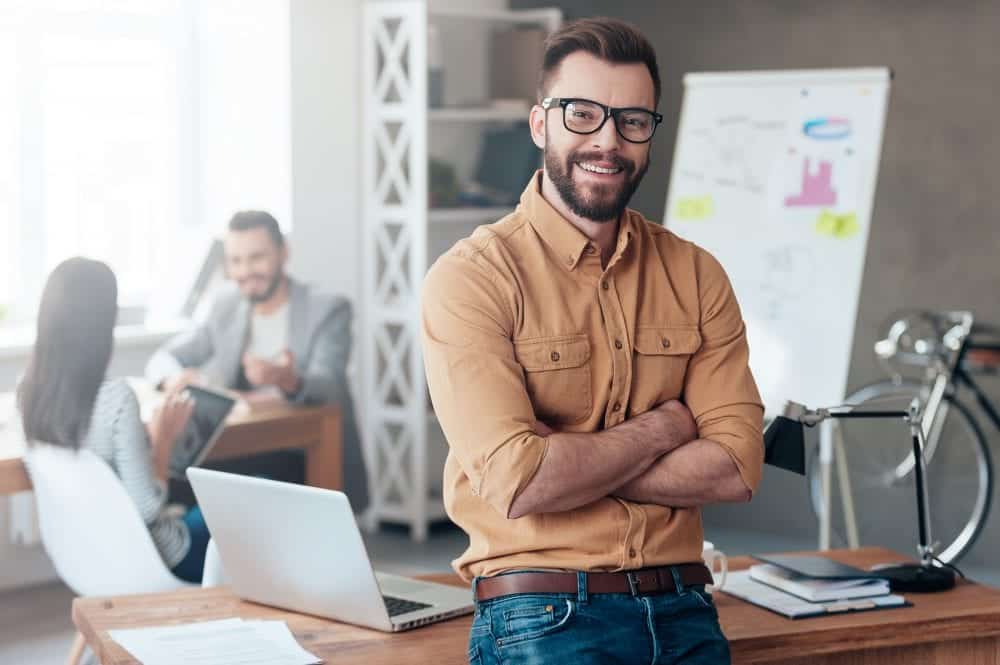 Man astanding in a workplace learning How to raise emotional intelligence.