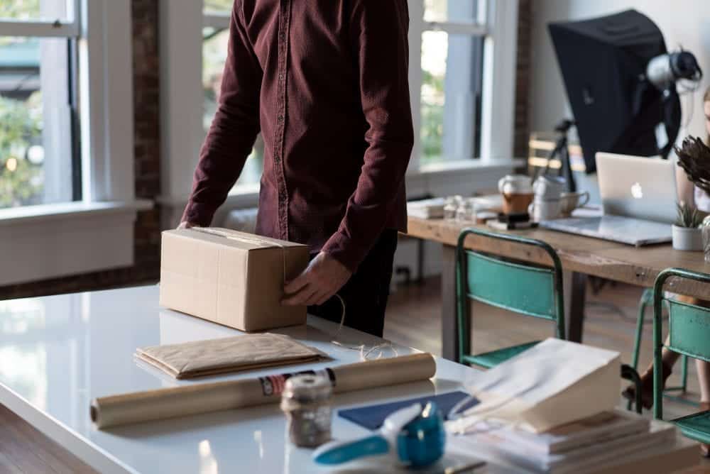 Person packing up their office space after getting laid off