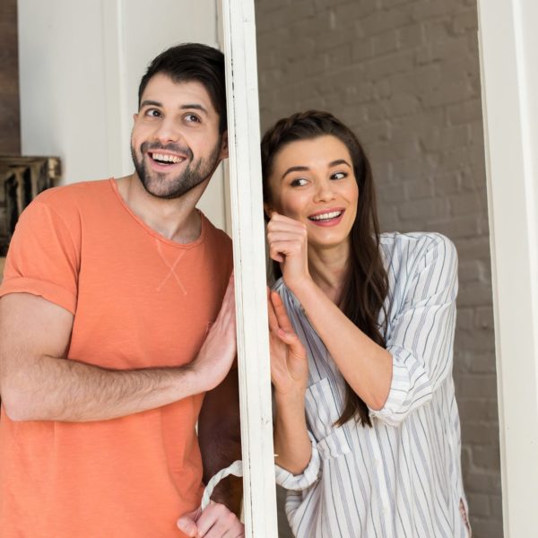 Man and woman separated by a wall but listening for each other's bids for affection