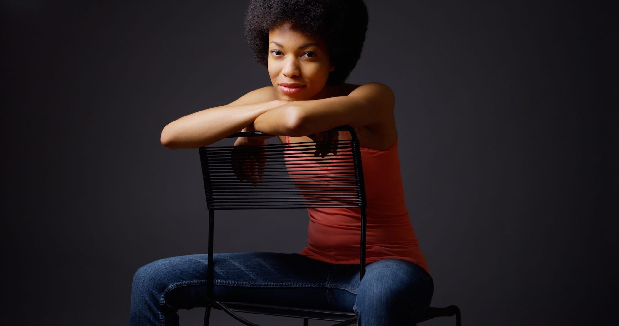 Woman sitting on a chair learning to create self confidence.