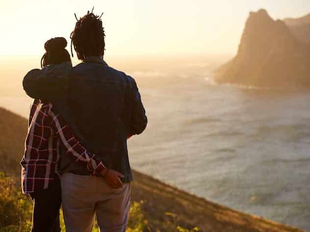 Couple looking out over the water wondering what xpectations in a relationship to avoid.