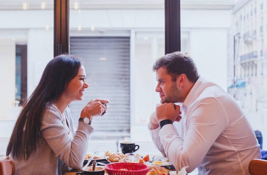 Man and woman dating after divorce talking on a date at a restaurant.