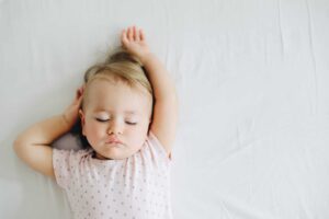 baby sleeping representing Practical tips for new parents.