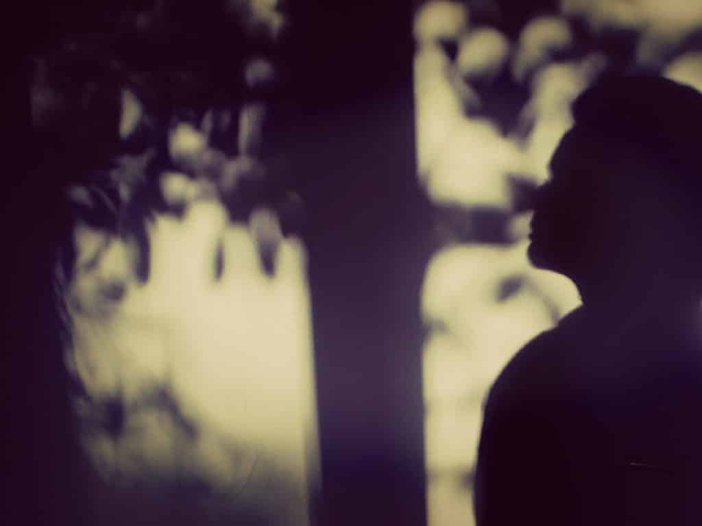 Person staring into nature. How to respond to gaslighting
