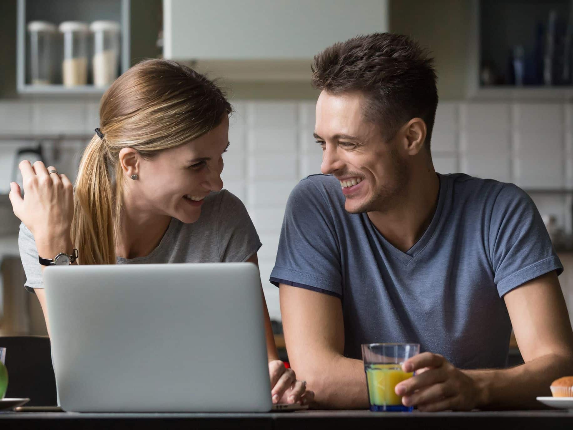 Couple working and talking in the kitchen representing How to Balance Your Career and Relationship