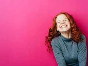 Woman smiling. How to create a joyful life.