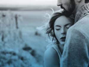 Man and woman hugging. What to do when you don't want to be touched.