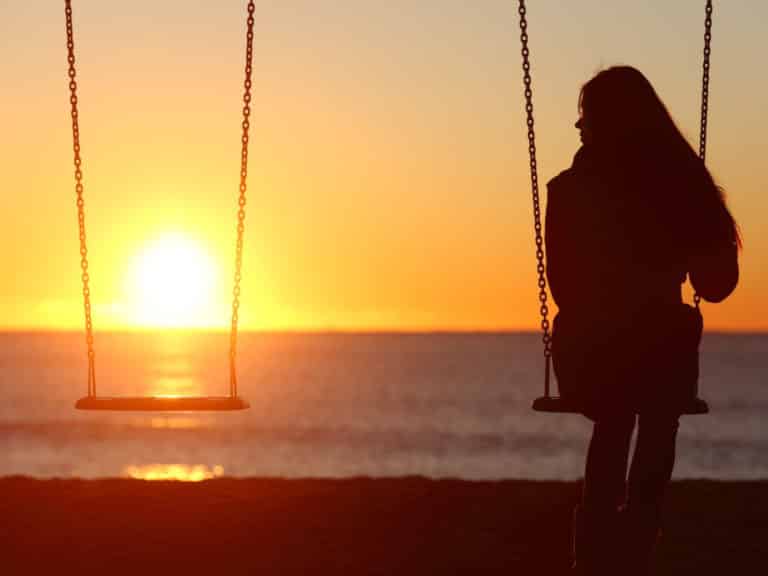 Two swings, only one person sitting on one representing Why friendships end.