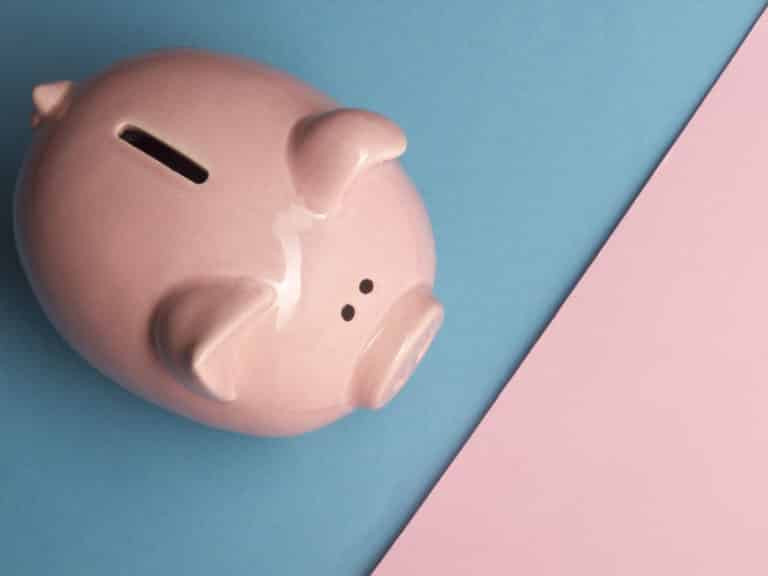 piggy bank with a coin slot. How to develop a healthy money mindset.