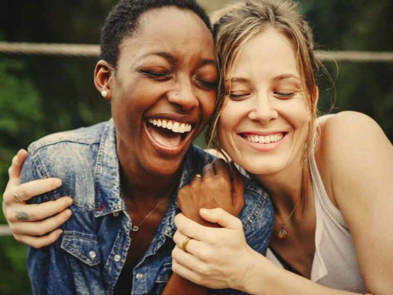 Happy friends holding each other. The power of connection.