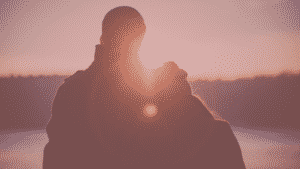 Couple facing towards the sunset. Emotional Safety.