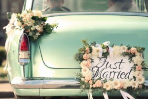 car with "just married" sign on the back representing premarital counseling questions... and answers.