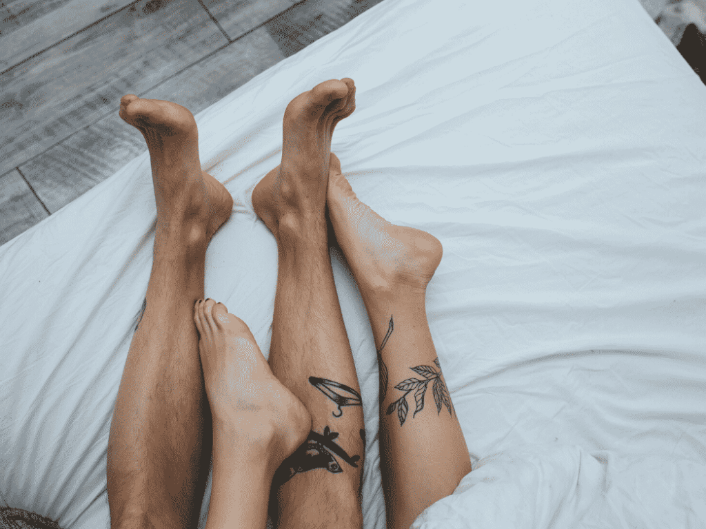 Couple in bed. how to keep stress from tanking your sex life.