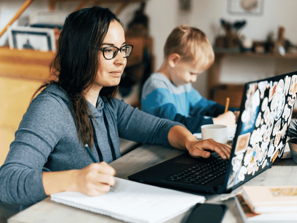 Woman working with a child next to her. Why is emotional intelligence important?
