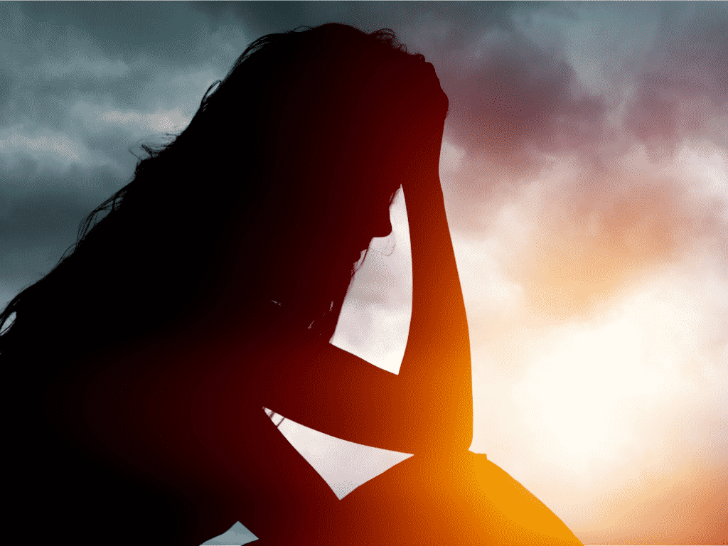 Woman with her hand on her forehead representing It's Okay to Cry: How to Handle Big Emotions