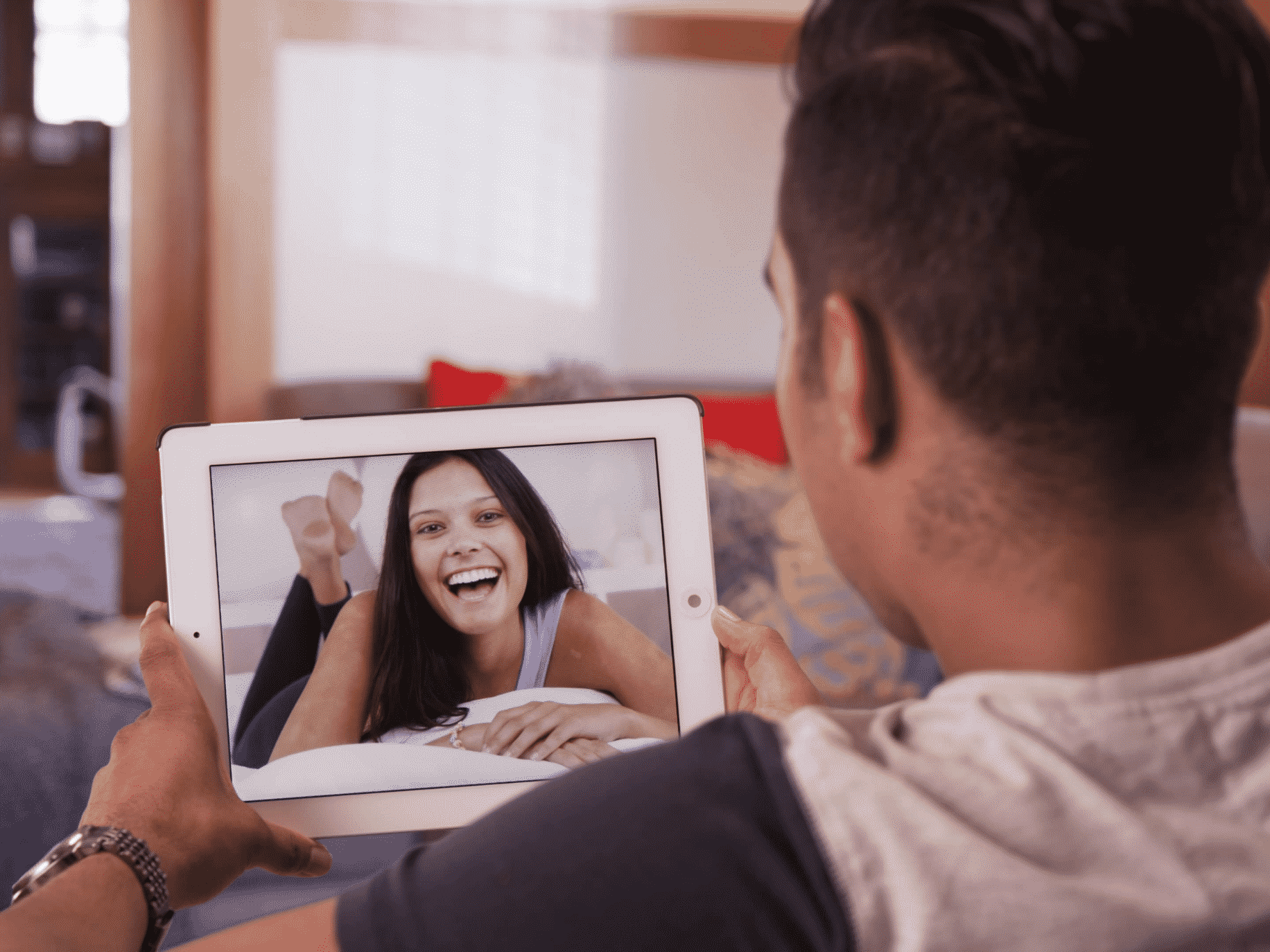 Man talking to woman over iPad. Long distance relationships