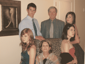 Family picture around a chair. Dysfunctional Family Roles