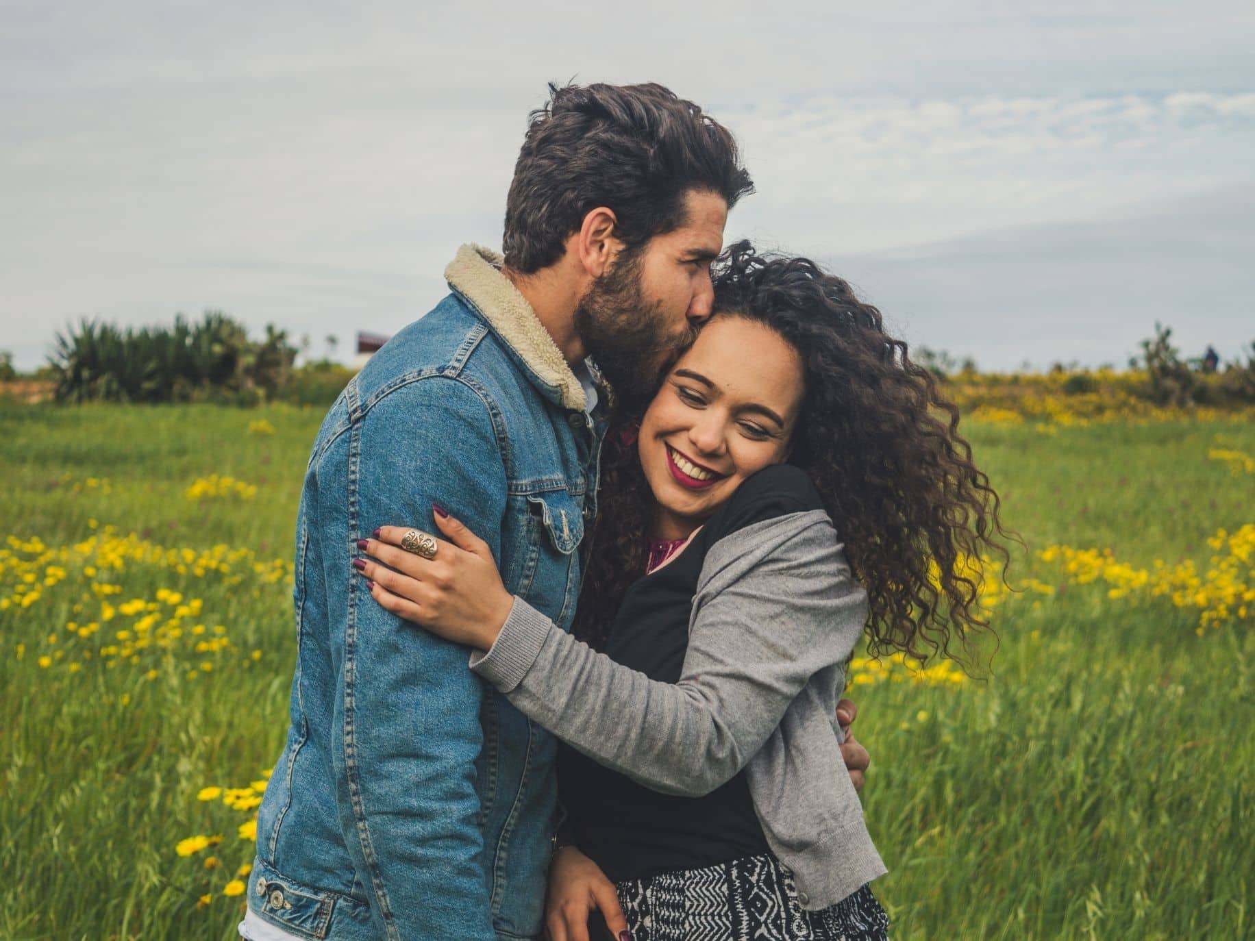 Happy couple embracing outside representing Finding the Right Person