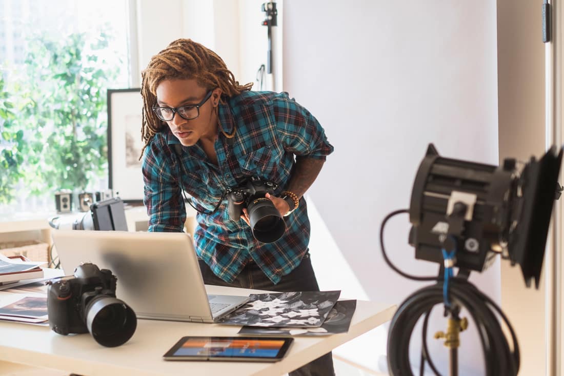 Photographer speaking with career development specialist online