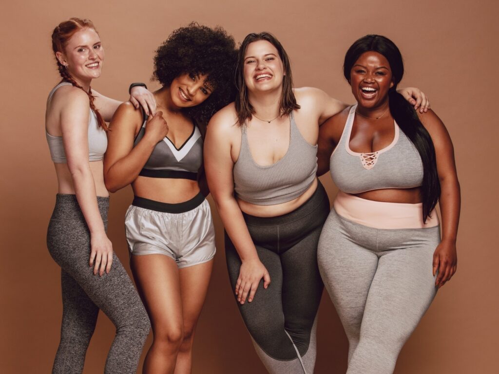 4 women embracing their bodies. Love your body.