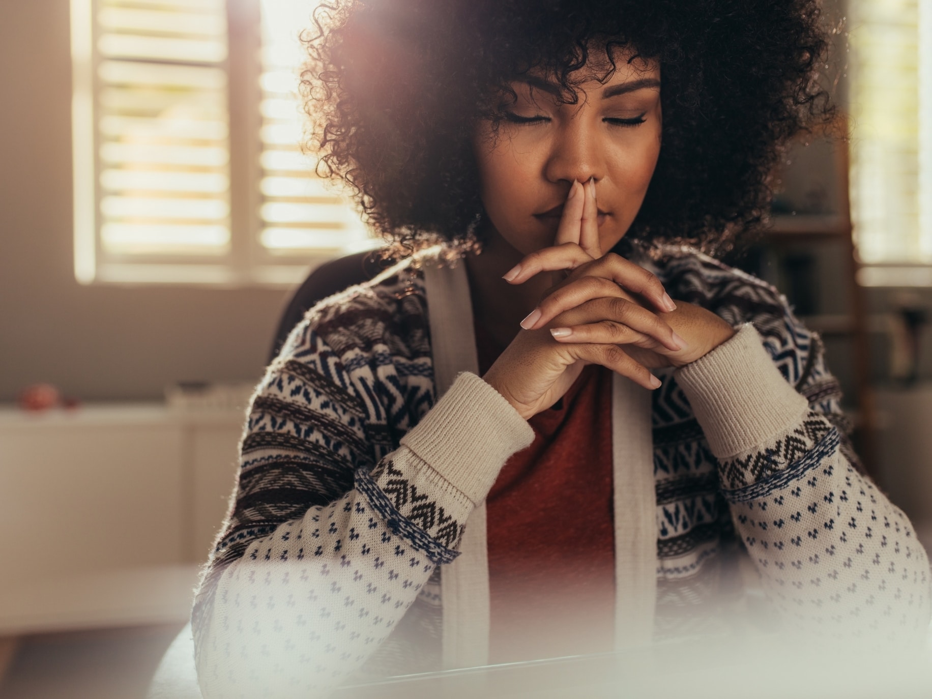 Woman deep in thought representing Mind-body connection.