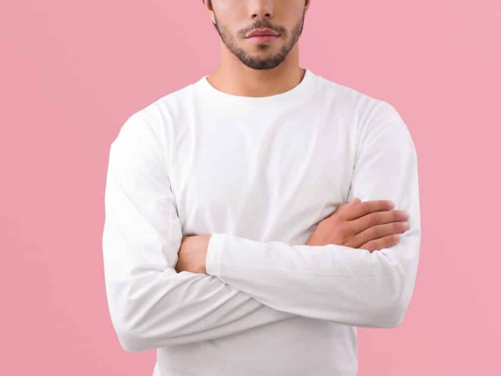 man with crossed arms representing Nonverbal communication.