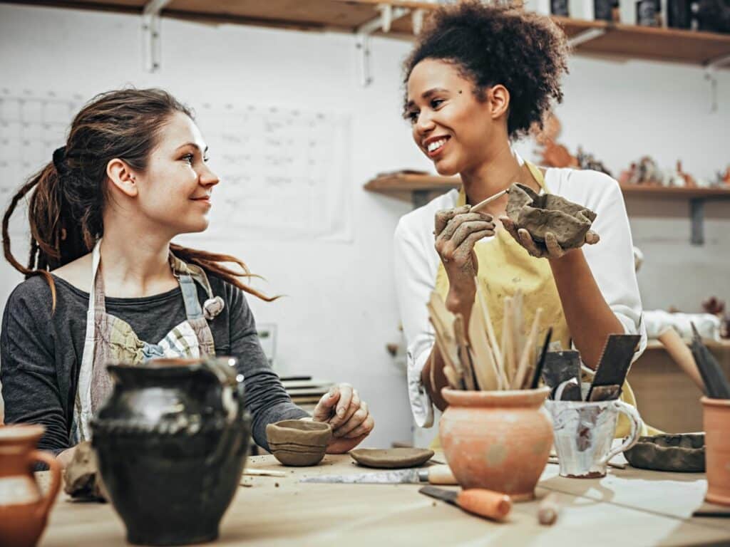 two women making pottery, being vulnerable