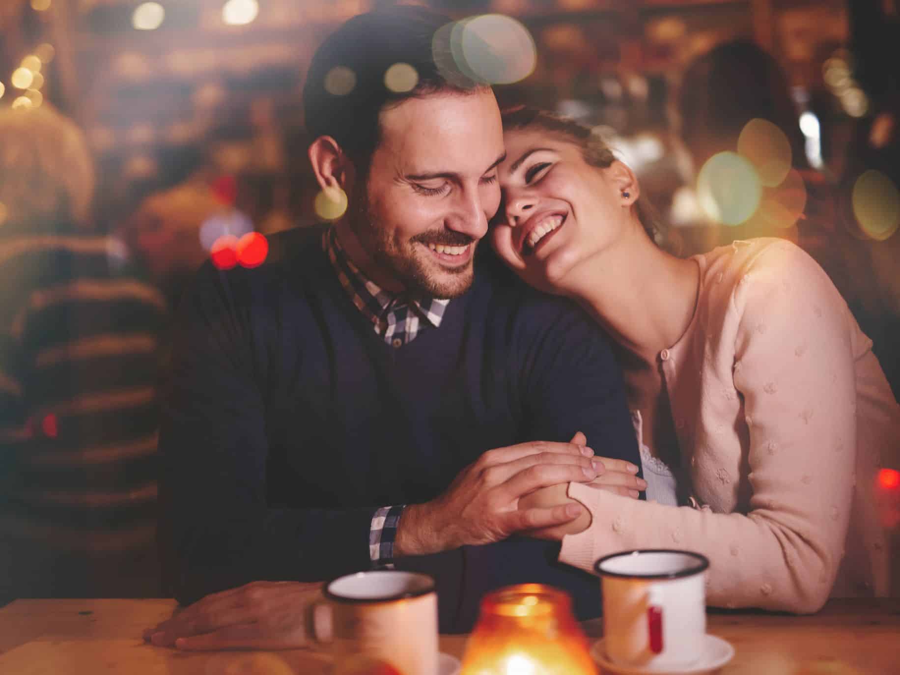 Couple in coffee shop practicing communication in relationships