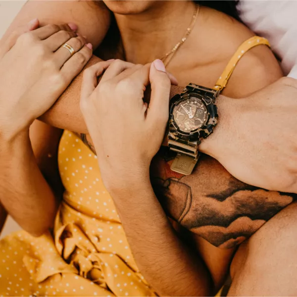 A man and a woman hold on to each other tight representing how to feel more secure in your relationship
