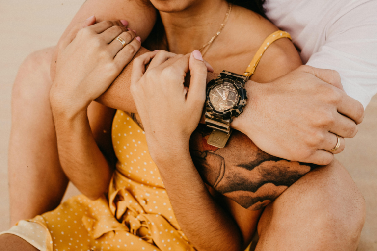 A man and a woman hold on to each other tight representing how to feel more secure in your relationship