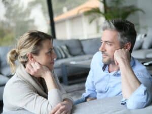 Couple connecting during a difficult conversation, representing how to communicate with your partner without fighting