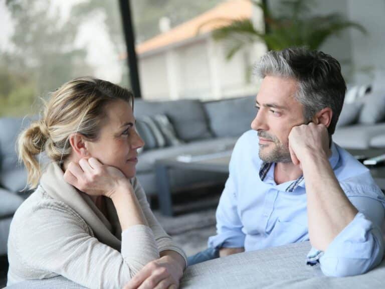Couple connecting during a difficult conversation, representing how to communicate with your partner without fighting