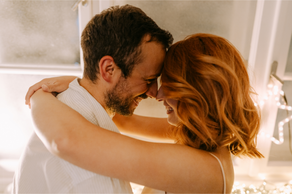 A couple shares an affectionate moment, representing free relationship advice from a marriage counselor