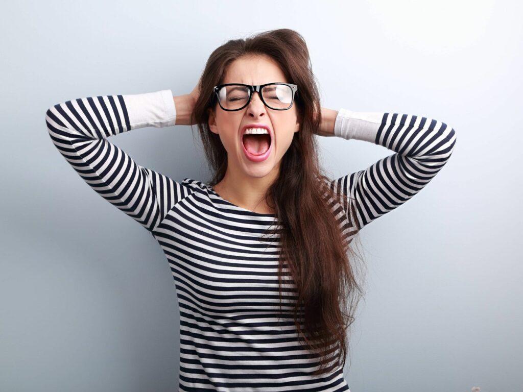 Woman in glasses frustrated and angry